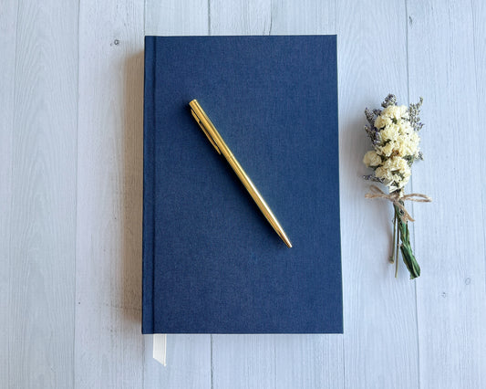 Signature Classic handbound journal in Midnight blue linen bookcloth with grosgrain ribbon bookmark and pearl cream endpapers.