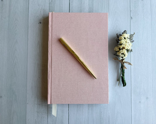 Signature Classic handbound journal in Petal pink linen bookcloth with grosgrain ribbon bookmark and pearl cream endpapers.